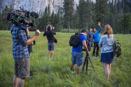 Alex Honnold being interviewed in El Capitan Meadow after free soloing Freerider. Clair Popkin and Jim Hurst document for the Free Solo documentary.   (National Geographic/Samuel Crossley)