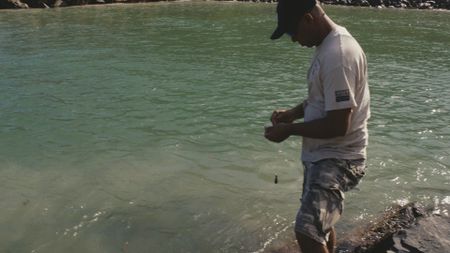 CBP AMO Supervisor Gene fishes in a local river in USVI.  (Lucky 8 TV/Paul Taggart)