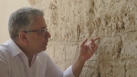 Osama Hisham Hameed showcasing the rebuild effort at the ancient city of Babylon. (Windfall Films)