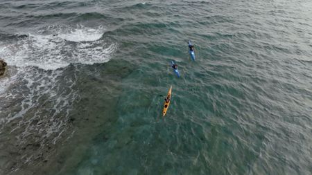 Drama recreation drone shot of Nick Bester and Ben Swart out on the water on surf ski's. (National Geographic/Samuel Gonzalez)