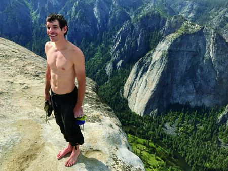 Holding all his climbing gear-his shoes and bag of chalk-Honnold stands atop El Capitan four hours after he began scaling it. "At the bottom, I was a little nervous," he said afterward. "I mean, it's a freaking-big wall above you." So what's next? "I still want to climb hard things. Someday. You don't just retire as soon as you get down."(Jimmy Chin)