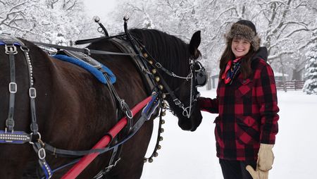 Dr. Erin Schroeder poses with Victor the horse. (National Geographic)