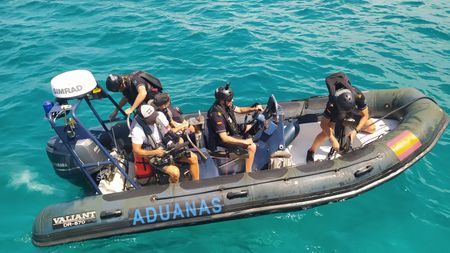 The crew goes on board on a tax agency speedboat in Palma de Mallorca, Balearic Islands, Spain. (National Geographic/Salvador Antonio Díaz Montes)