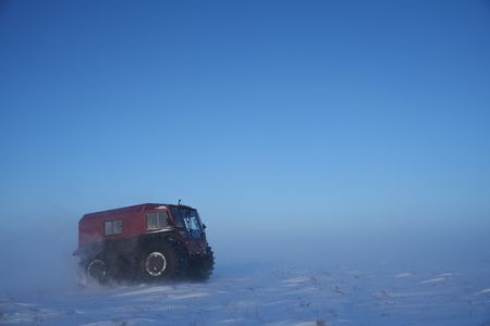 Sue Aikens in her all terrain vehicle, travels across the snowy tundra. (BBC Studios Reality Productions, LLC/Jayce Kolinski)