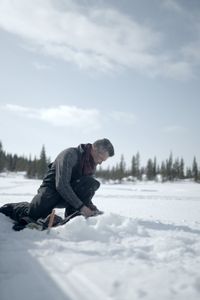 Joel Jacko fishing on the frozen lake. (National Geographic/Wayne Shockey)