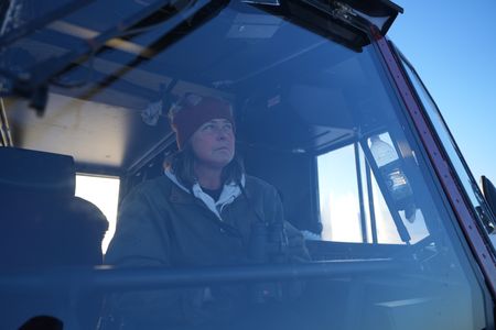 Sue Aikens searches for nearby wolves spotted in the area of her camp. (BBC Studios Reality Productions, LLC/IJayce Kolinski)