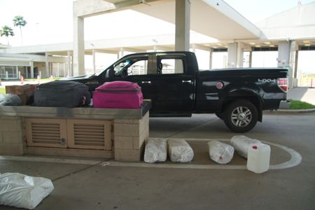 A suspect's vehicle is parked in secondary so CBP officers can inspect the interior in Pharr, Texas. (National Geographic)