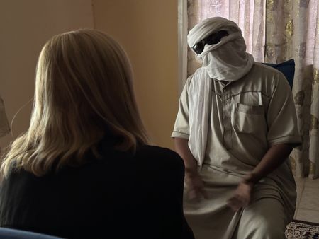 Mariana van Zeller interviews Ismael to try to find passage out of Niger. (National Geographic for Disney)