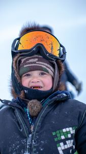 Sabastian Hailstone helps his grandparent's, Agnes and Chip Hailstone set up their camp in Kiwalik. (BBC Studios Reality Productions/Ashton Hurlburt)