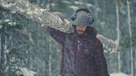 Matty carries a log home to his cabin. (Blue Ant Media/Tara Elwood)