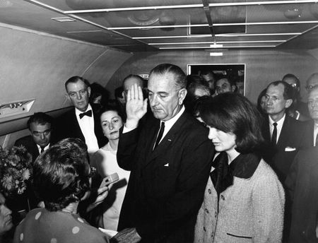 Lyndon B. Johnson is sworn in as President of the United States during ceremony aboard Air Force One, Nov. 22, 1963, in Dallas.  Former first lady Jacqueline Kennedy stood beside him during the ceremony. (Cecil Stoughton/White House Photographs/John F. Kennedy Presidential Library and Museum, Boston).