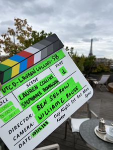 Lauren Collins and Stéphane Bourgoin's names appear in  a clapboard used in the production of "Killer Lies: Chasing a True Crime Con Man," a documentary series about obsession and deception, following the unraveling of Stephane Bourgoin’s career as a best-selling author and serial killer expert. (National Geographic/Ben Selkow)