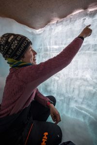 Dr. Heidi Sevestre measures the snowpack on the Renland Icecap in Eastern Greenland.  (photo credit: National Geographic/)