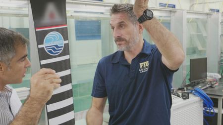 Dr. Yannis Papastamatiou, expert, speaking to Professor Oscar M. Curet, expert, about the sounds Hydrofoils make in the water. (National Geographic)