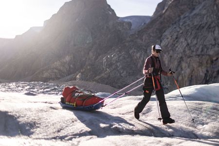 Dr. Heidi Sevestre traverses a stretch of dry glacier in Eastern Greenland.  (photo credit: National Geographic/Pablo Durana)