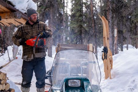 Johnny Rolfe builds his dog Java a box seat that will attach to his sled. (BBC Studios Reality Production/Patrick Henderson)