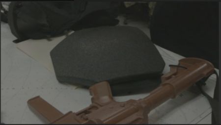 Padding for a bulletproof vest and a firearm are pictured on a table, ready to be used by agents during an operation in Mayag¸ez, P.R. (Lucky 8 TVIvan Leon)