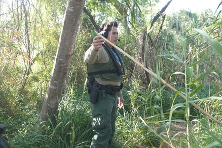 Border Patrol Agent Weeks looks for signs of migrants attempting to illegally cross the border in the Rio Grande Valley, Texas. (National Geographic)