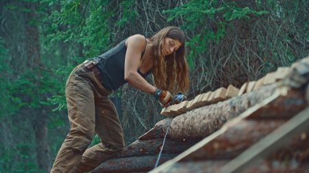 Margot works on her roof before she's gone for the summer. (Blue Ant Media)