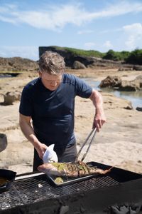 Puerto Rico - Gordon Ramsay works on his stuffed whole red snapper during the final cook in Puerto Rico. (Credit: National Geographic/Justin Mandel)