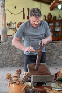 Oaxaca, Mexico - Gordon Ramsay uses a 50-year-old tool to grind cocoa beans. (Credit: National Geographic/Justin Mandel)