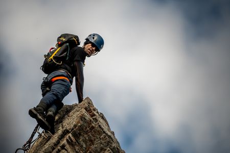 Joseph Fiennes scales a sheer cliff-face at the Via Ferrata, British Columbia, Canada. Amidst mountains and whale watching, Sir Ranulph Fiennes and his cousin Joseph Fiennes reflect on Ran’s epic life and his new challenge of life with Parkinson’s. (National Geographic)
