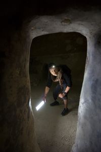 Acre, Israel - Dr. Albert Lin enters an underground crusader-era tunnel. (Blakeway Productions/National Geographic)