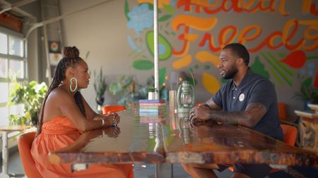 BLACK TRAVEL ACROSS AMERICA - Host Martinique Lewis (Marty) sits down to talk with Chris Goode, founder and owner of Ruby Jean's Juicery in Kansas City, MO, about his inspiration and mission. (National Geographic for Disney)