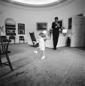 President John F. Kennedy claps while his son John Jr. dances in the Oval Office at the White House, Oct. 10, 1962. (Cecil Stoughton/John F. Kennedy Presidential Library and Museum, Boston)