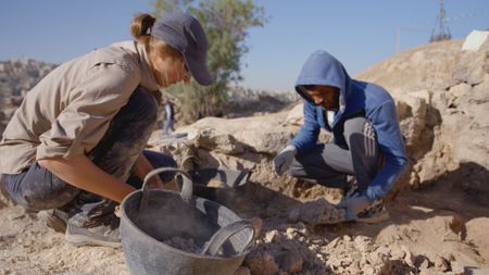 Kim Thomas and Mohamad Ali Jaar search at the site. (Windfall Films)