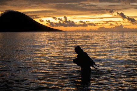 Octopus researcher, Dr. Crissy Huffard, heading out on a sunset scouting snorkel for Algae octopus (Abdopus aculeatus) in Bunaken Marine Park.  (photo credit: National Geographic/Annabel Robinson)