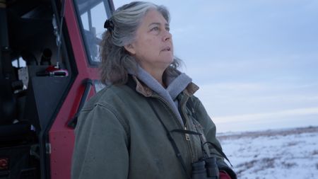 Sue Aikens hunts ptarmigan in the tundra near her camp. (BBC Studios/Michael Cheeseman)