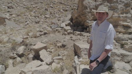 Archaeologist Pearce Paul Creasman poses for a portrait in Tel Dhiban. (Windfall Films/Alex Collinge)