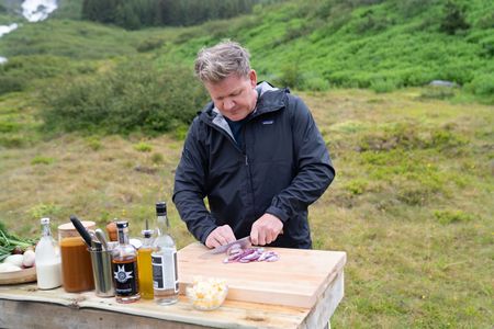 Iceland - Gordon Ramsay prepares a marinade for his freshly caught salmon during the final cook in Iceland. (Credit: National Geographic/Justin Mandel)
