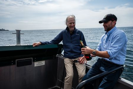 Sir Ranulph Fiennes and Joseph Fiennes celebrate the end of their journey with a bottle of champagne. Sir Ranulph Fiennes, "the greatest living explorer," and his cousin, actor Joseph Fiennes, revisit Ran’s 1971 expedition of Canada’s British Columbia.
