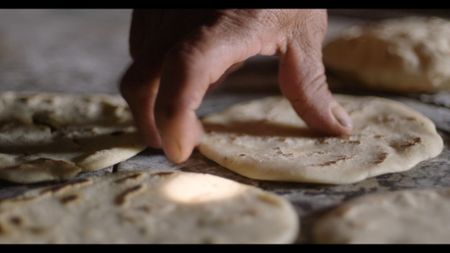 Dona Feliciana Yaqui makes homemade tortillas in the Patzún Municipality, Guatemala. (National Geographic)