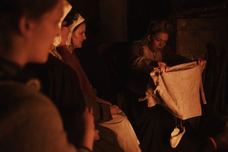 A bonnet falls to the floor as Mary Dunbar unwraps the knotted parcel. (Dash Productions Services LTD/Antoan Ivanov)