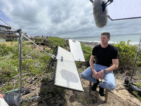 BTS shot of Jason Lammers mid-interview on the beach. (National Geographic/Robert Cowling)