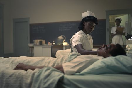 Betty Shabazz, played by Jayme Lawson, cares for Hinton in GENIUS: MLK/X. (National Geographic/Richard DuCree)