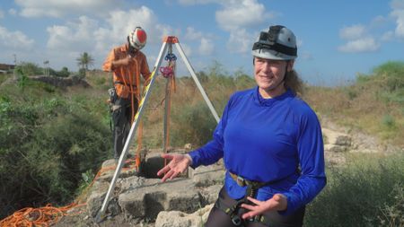 Moshiko Pilo and Prof. Beverly Goodman explore a well in Caesarea, Israel. (Windfall Films)