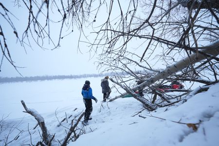 Chevie Roach teaches his son Ryder how to set marten traps along their trapline. (BBC Studios Reality Productions, LLC/Jayce Kolinski)