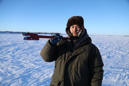 Avery Hoffman setting fish nets under the ice with his brother for subsistence food during the winter season. (BBC Studios Reality Productions, LLC/Isaiah Branch - Boyle)