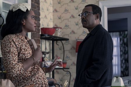 Coretta, played by Weruche Opia, makes an important call as Daddy King, played by Lennie James, looks on in GENIUS: MLK/X. (National Geographic/Richard DuCree)