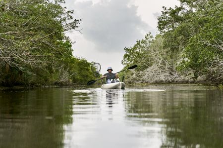 Anthony Mackie kayaking along the Bayous near Violet, Louisiana, which are fed by the Mississippi River. (National Geographic/Brian Roedel)