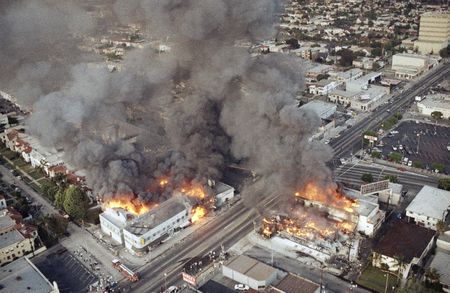 Commercial structures burn at Venice Boulevard and Western Avenue in Los Angeles on Thursday, April 30, 1992, on the second day of rioting in the city. (AP Photo/Paul Sakuma)