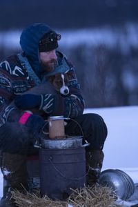 Jessie Holmes with his dog camping during the winter season. (BBC Studios Reality Productions, LLC/JR Masters)