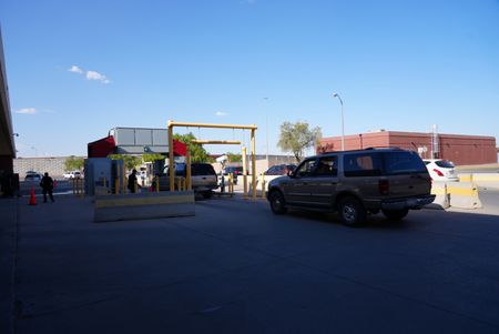 Multiple cars wait in line to pass under the Z-portal X-ray machine at the El Paso border  in El Paso, Texas. (National Geographic)