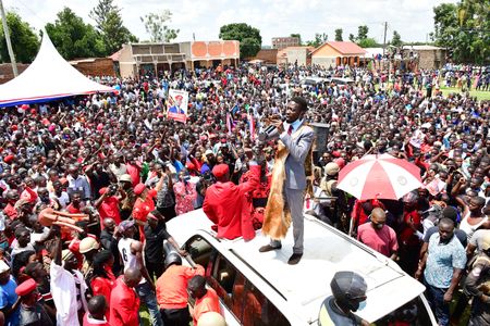 Robert Kyagulanyi Ssentamu (standing on roof of the vehicle), a candidate in Uganda's general elections in 2021 and widely regarded as the closest challenger to incumbent Yoweri Museveni, campaigns in Butaleja district in the country's East on November 17, 2020.  (photo credit: Lookman Kampala)