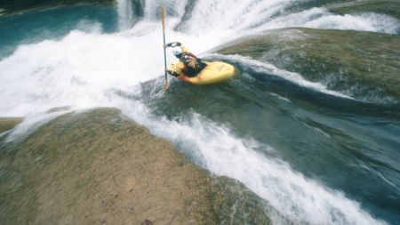 Gerd Serrasolses kayaks down a waterfall.  (mandatory photo credit: Rush Sturges / River Roots Productions)