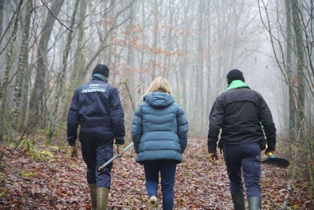 Guy Mom per from the Metz demining center and Alex Churchill walk through the "Red Zone" forest near Verdun, France. An area where an estimated 8 million shells fell without exploding during WW1. Many shells still remain untouched in the forest. (National Geographic/Ciaran Henry)